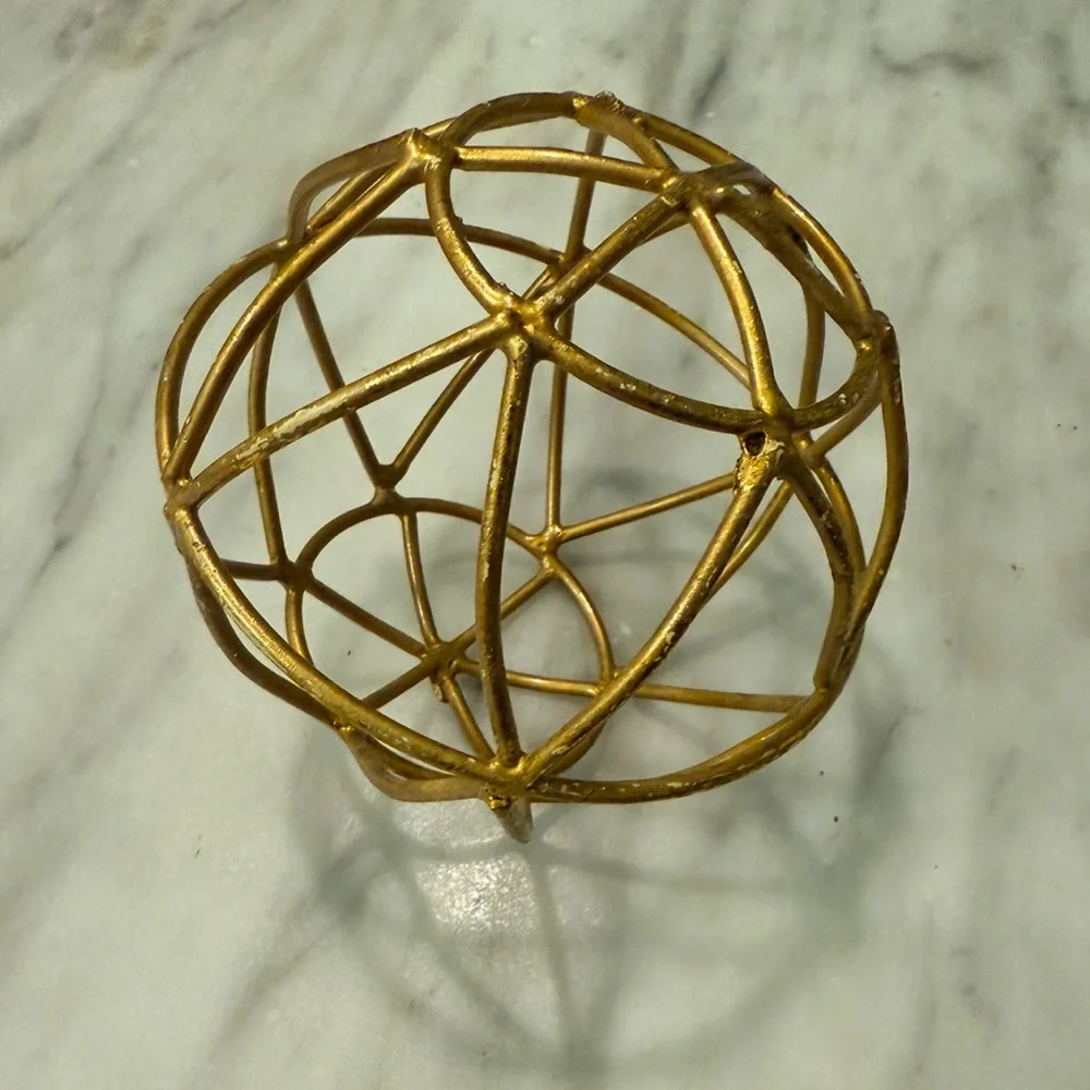 Gold round sculpture